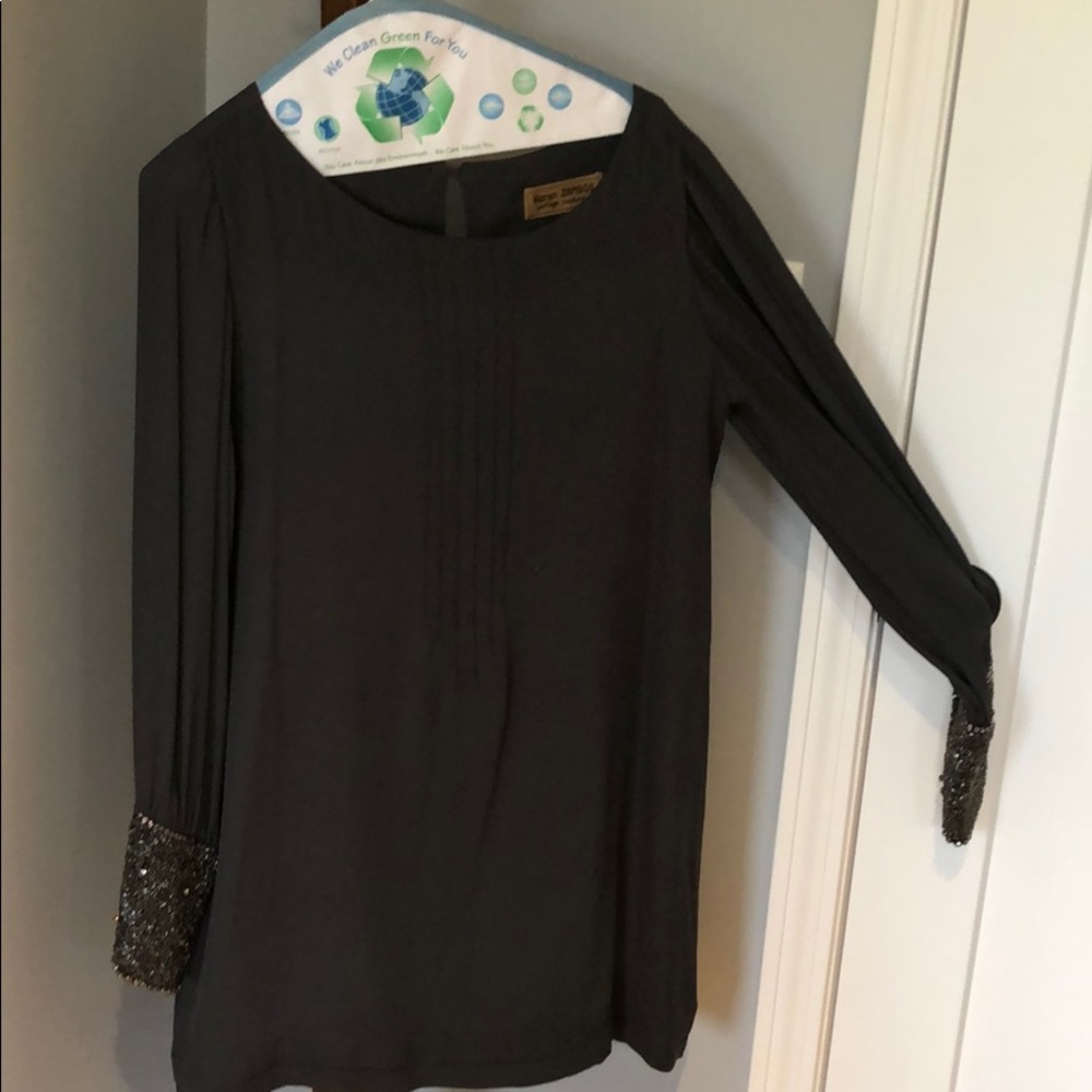 Charcoal dress with embellished cuffs.